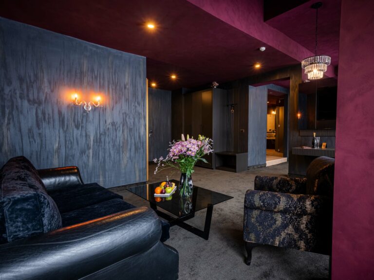 Suite with sofa and armchairs at Premier Luxury Mountain Resort, Bansko