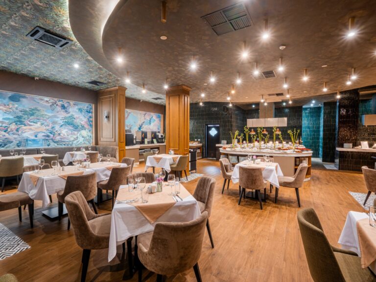Elysium restaurant dining hall with columns at Premier Luxury Mountain Resort, Bansko