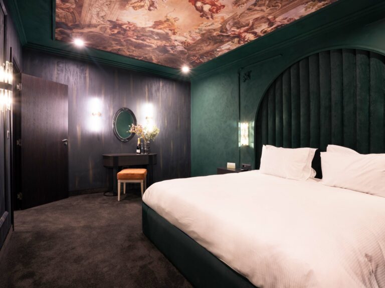 Room with dark green walls and double bed at Premier Luxury Mountain Resort, Bansko