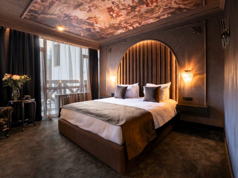 Bedroom with upholstered headboard at Premier Luxury Mountain Resort, Bansko