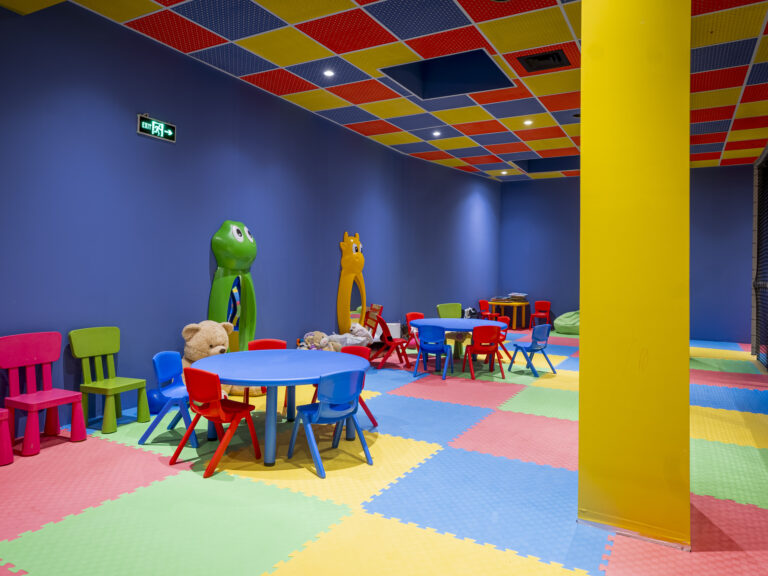 Kids’ club play area with tables and chairs at Premier Luxury Mountain Resort, Bansko