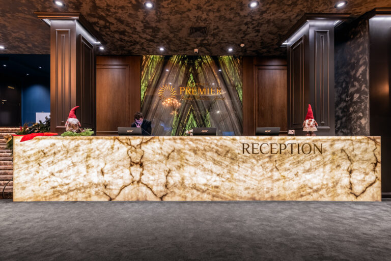 Hotel reception with backlit onyx desk at Premier Luxury Mountain Resort, Bansko