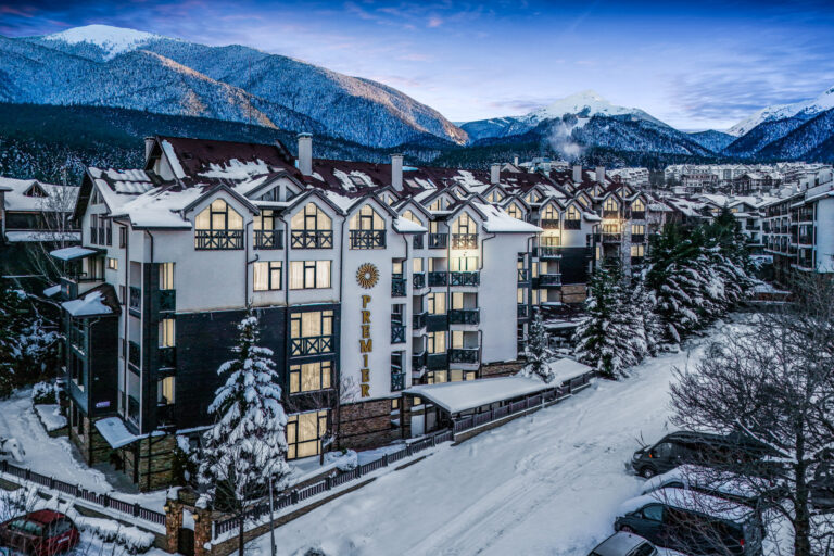 Snow-covered hotel in winter with Pirin Mountains at Premier Luxury Mountain Resort, Bansko