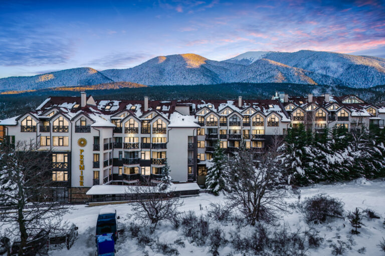 Premier Luxury Mountain Resort in winter with snowy Pirin peaks at Premier Luxury Mountain Resort, Bansko