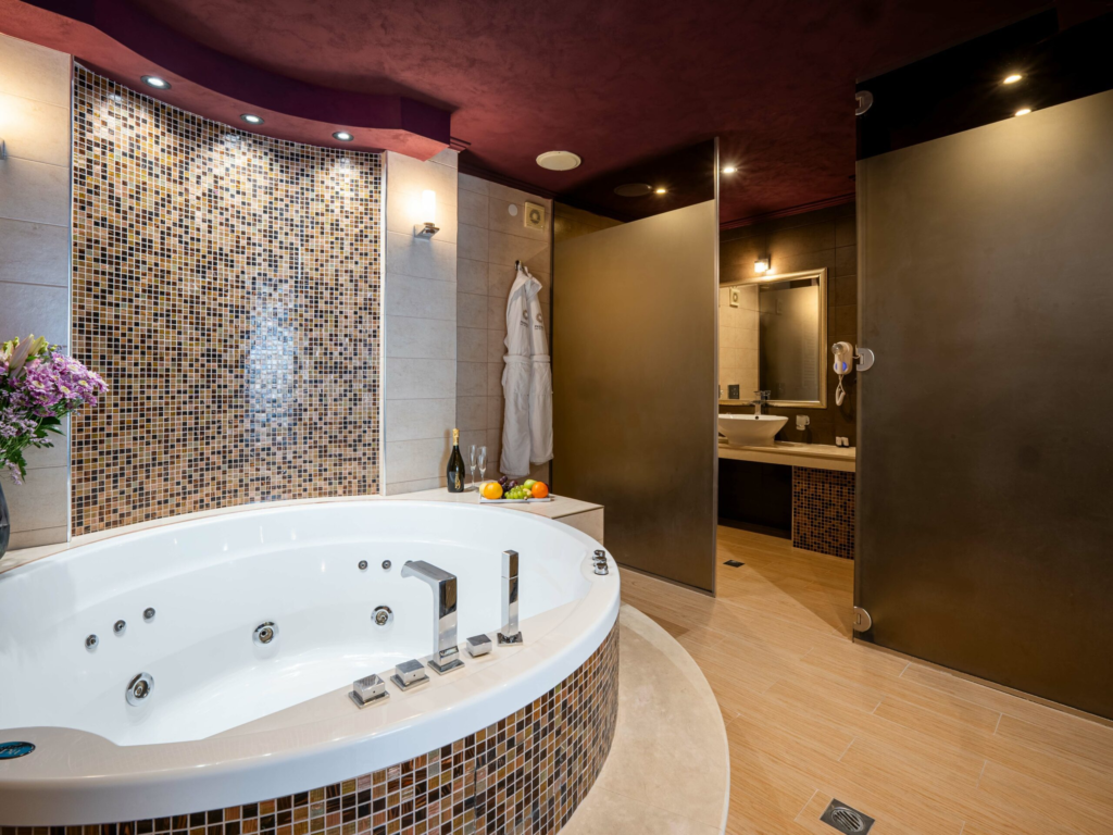 Suite bathroom with jacuzzi bathtub at Premier Luxury Mountain Resort, Bansko