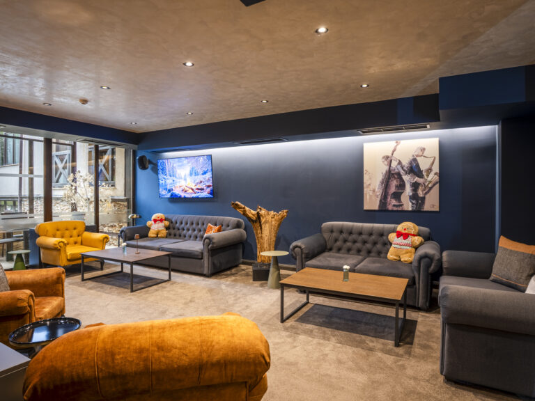 Lounge seating with yellow armchairs at Premier Luxury Mountain Resort, Bansko