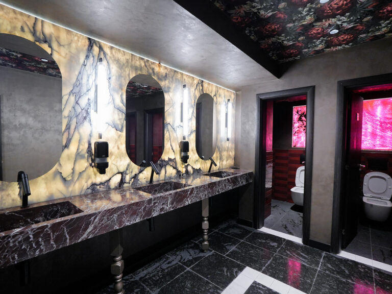 Spa changing room with marble vanity and illuminated mirrors at Premier Luxury Mountain Resort, Bansko