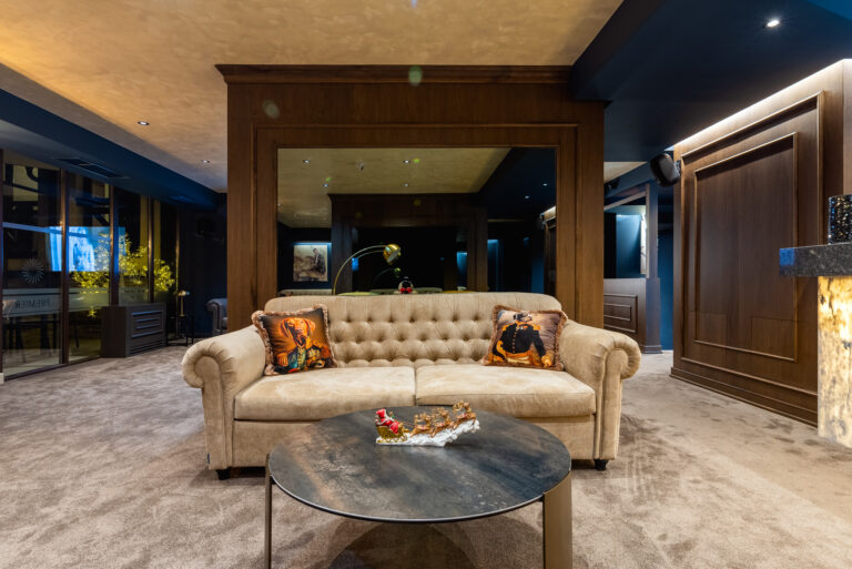Lounge with chesterfield sofa and coffee table at Premier Luxury Mountain Resort, Bansko