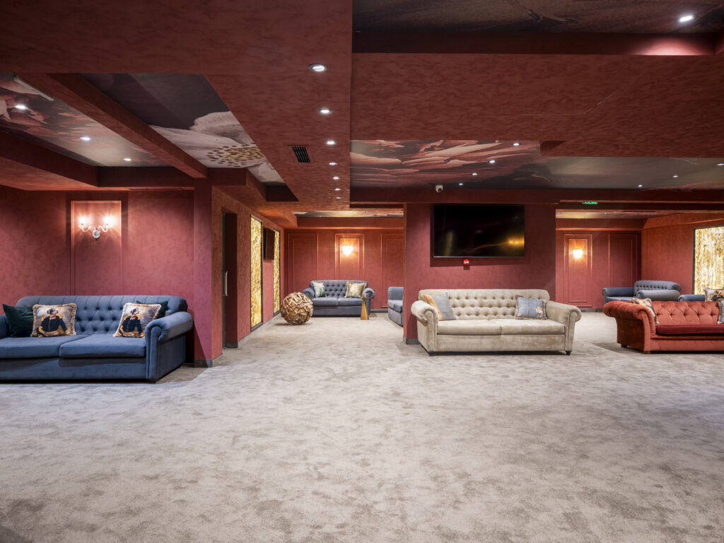 Elegant lounge with chesterfield sofas at Premier Luxury Mountain Resort, Bansko