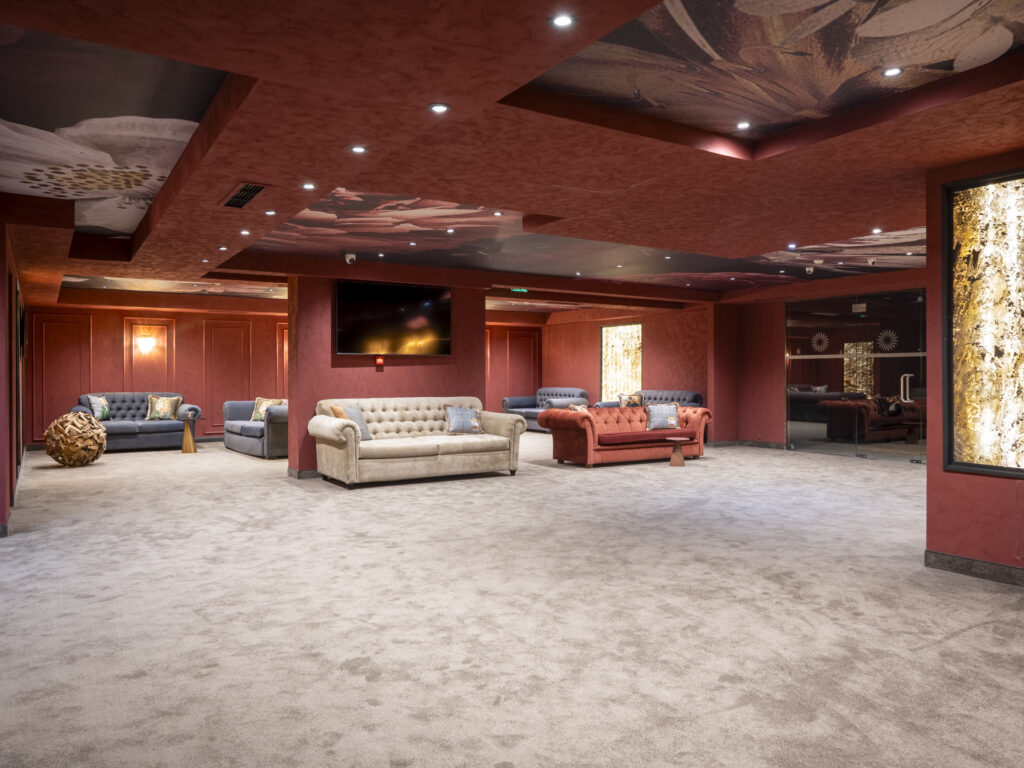 Elegant lounge with chesterfield sofas at Premier Luxury Mountain Resort, Bansko