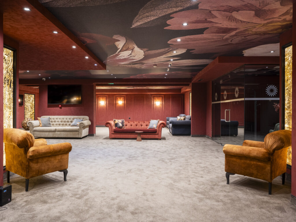 Elegant lounge with chesterfield sofas at Premier Luxury Mountain Resort, Bansko