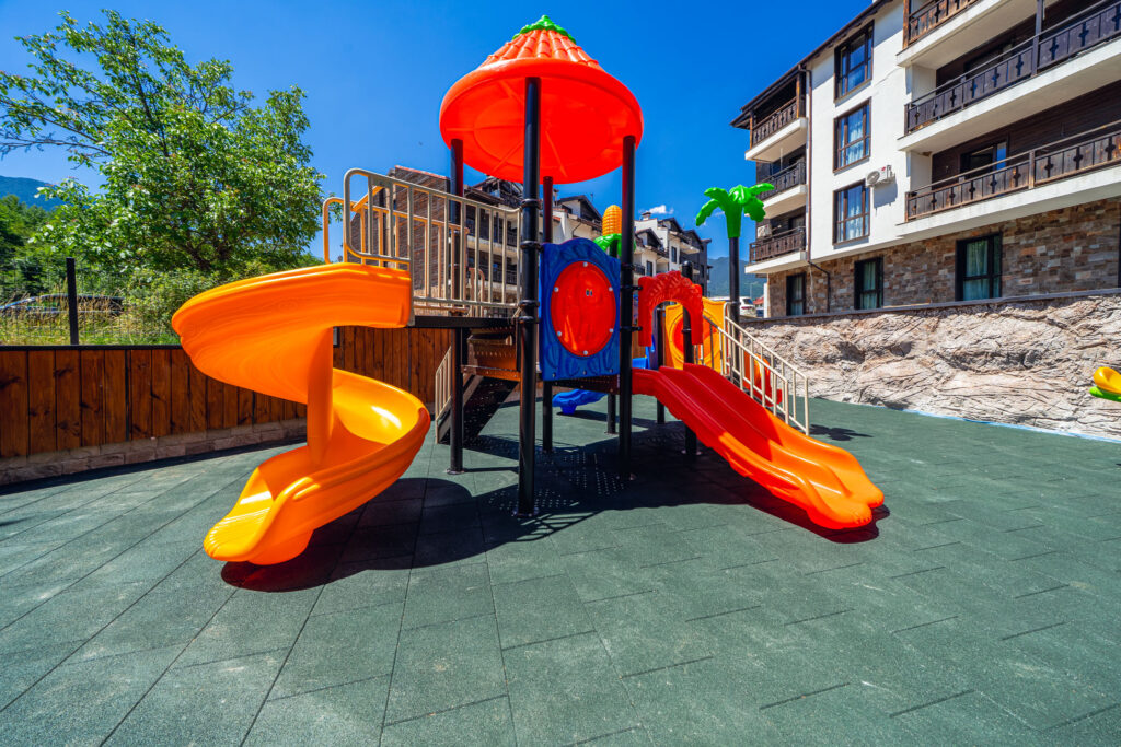 Outdoor children's playground in the garden of Premier Luxury Mountain Resort, Bansko