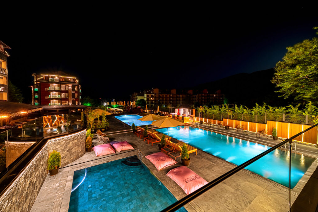 Outdoor children’s pool at night at Premier Luxury Mountain Resort, Bansko