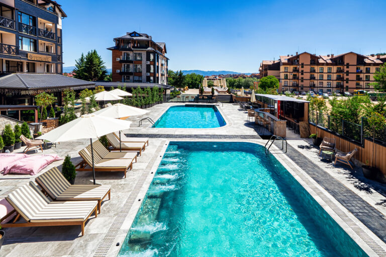 Heated outdoor pool with hydromassage jets at Premier Luxury Mountain Resort, Bansko
