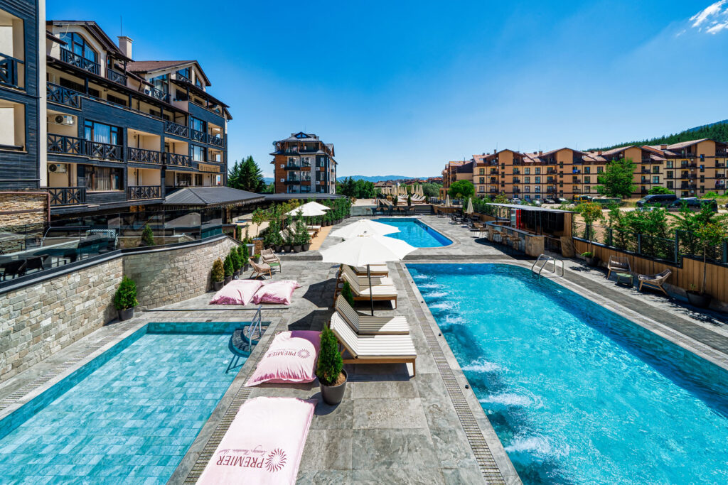 Heated outdoor pool with hydromassage jets at Premier Luxury Mountain Resort, Bansko