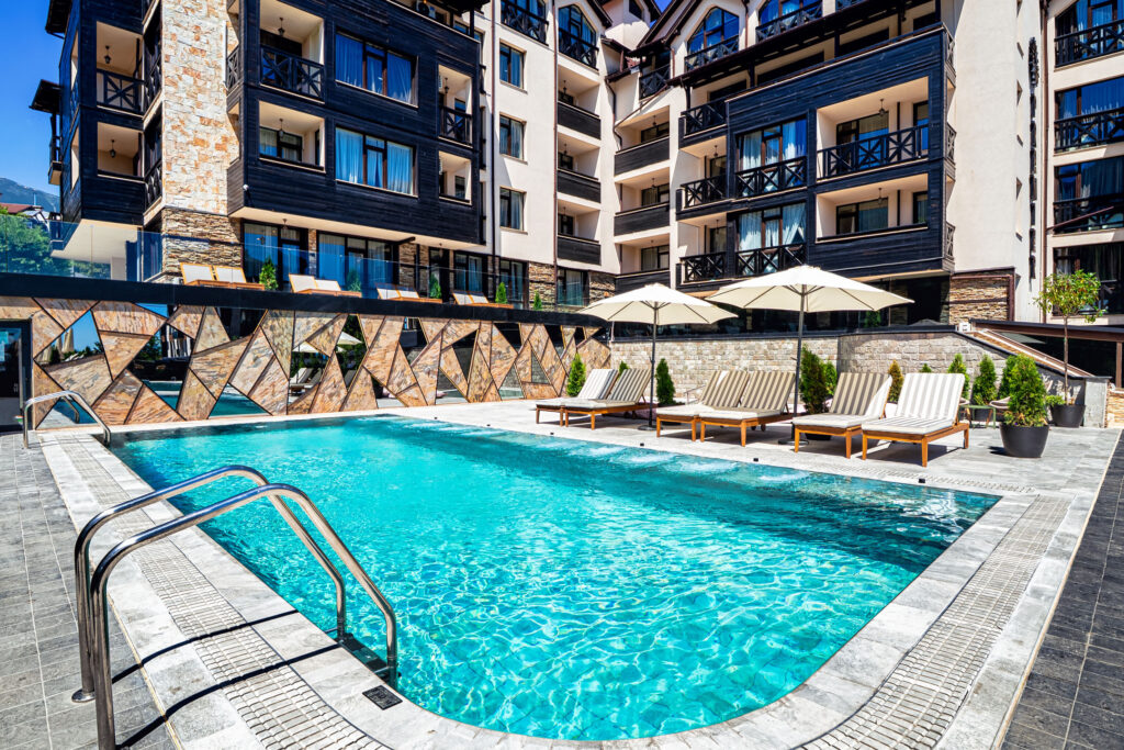 Heated outdoor pool with hydromassage jets at Premier Luxury Mountain Resort, Bansko