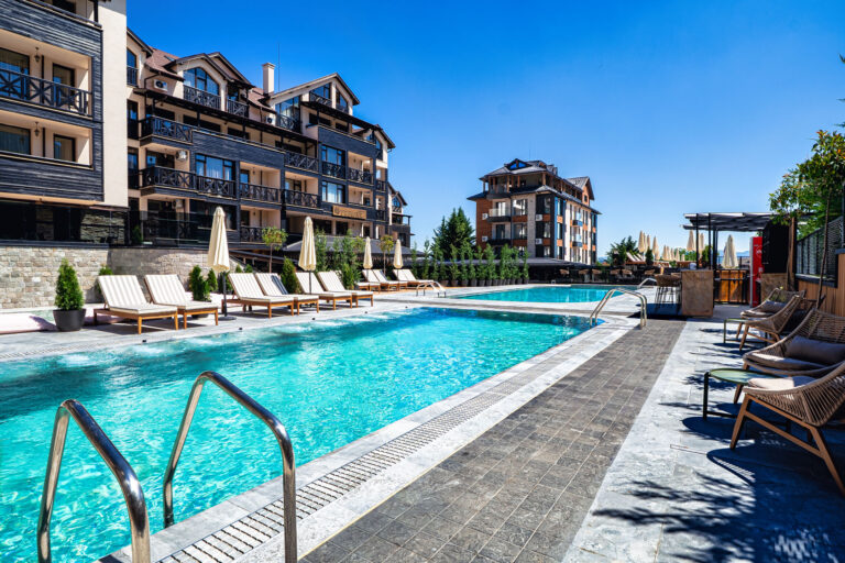 Heated outdoor pool with hydromassage jets at Premier Luxury Mountain Resort, Bansko