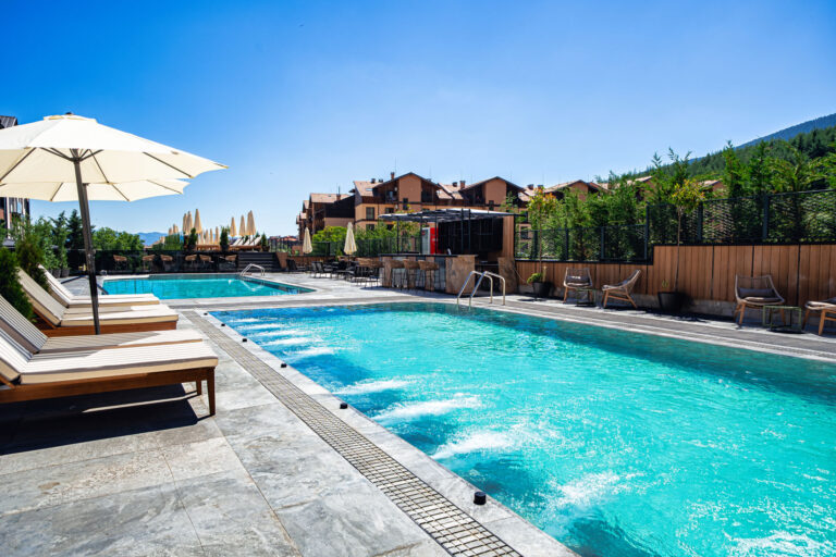 Heated outdoor pool with hydromassage jets at Premier Luxury Mountain Resort, Bansko