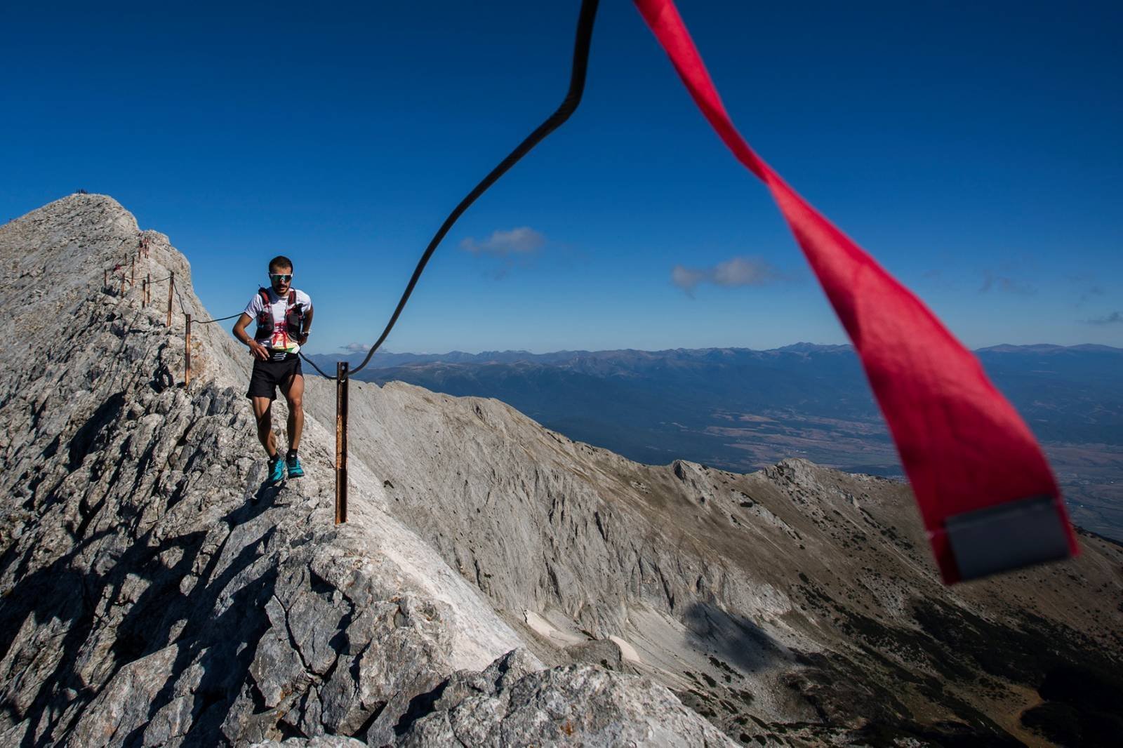 Runner on a mountain ridge during the Pirin Ultra Marathon